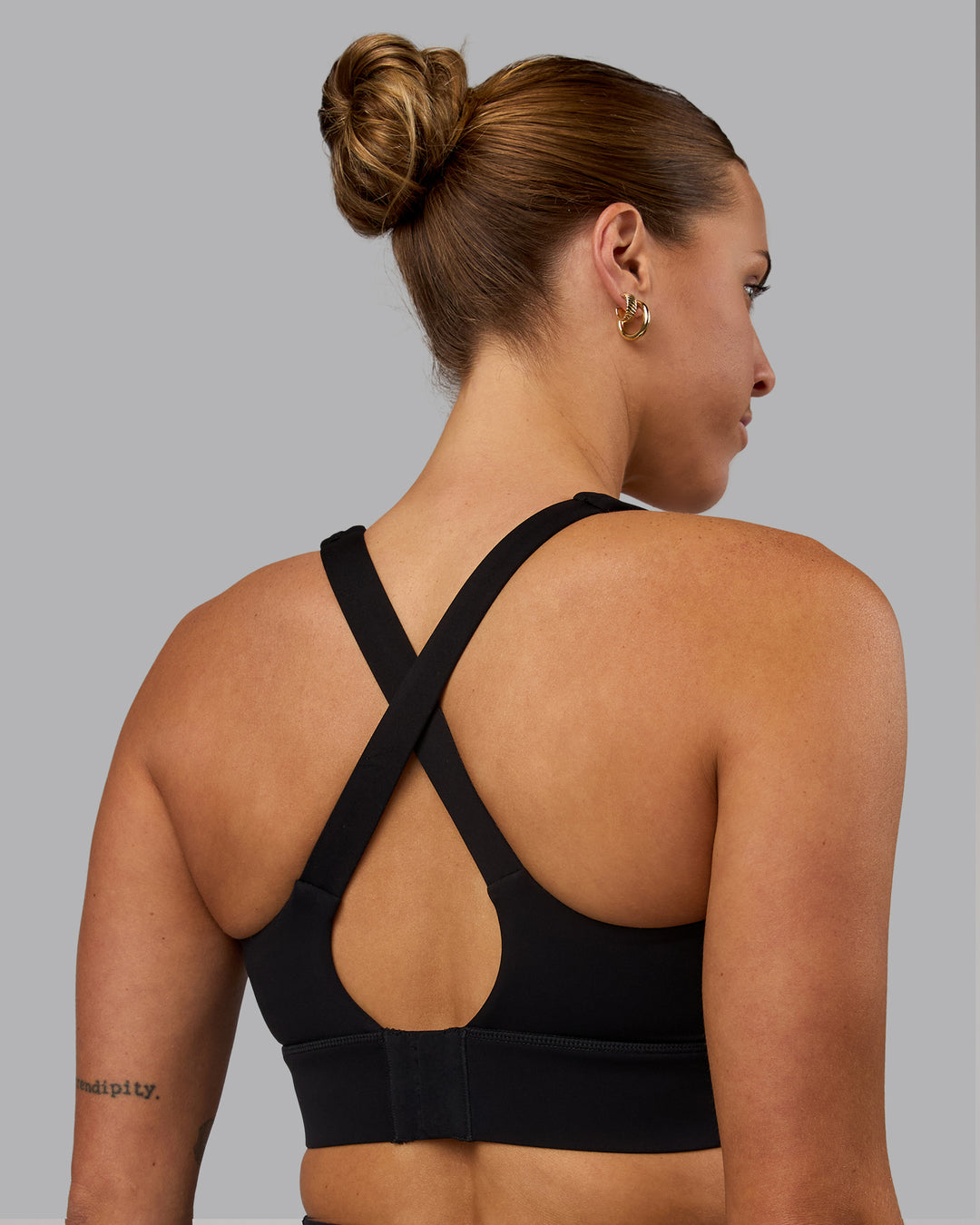 Woman wearing Sculpt Sports Bra - Black - view 2