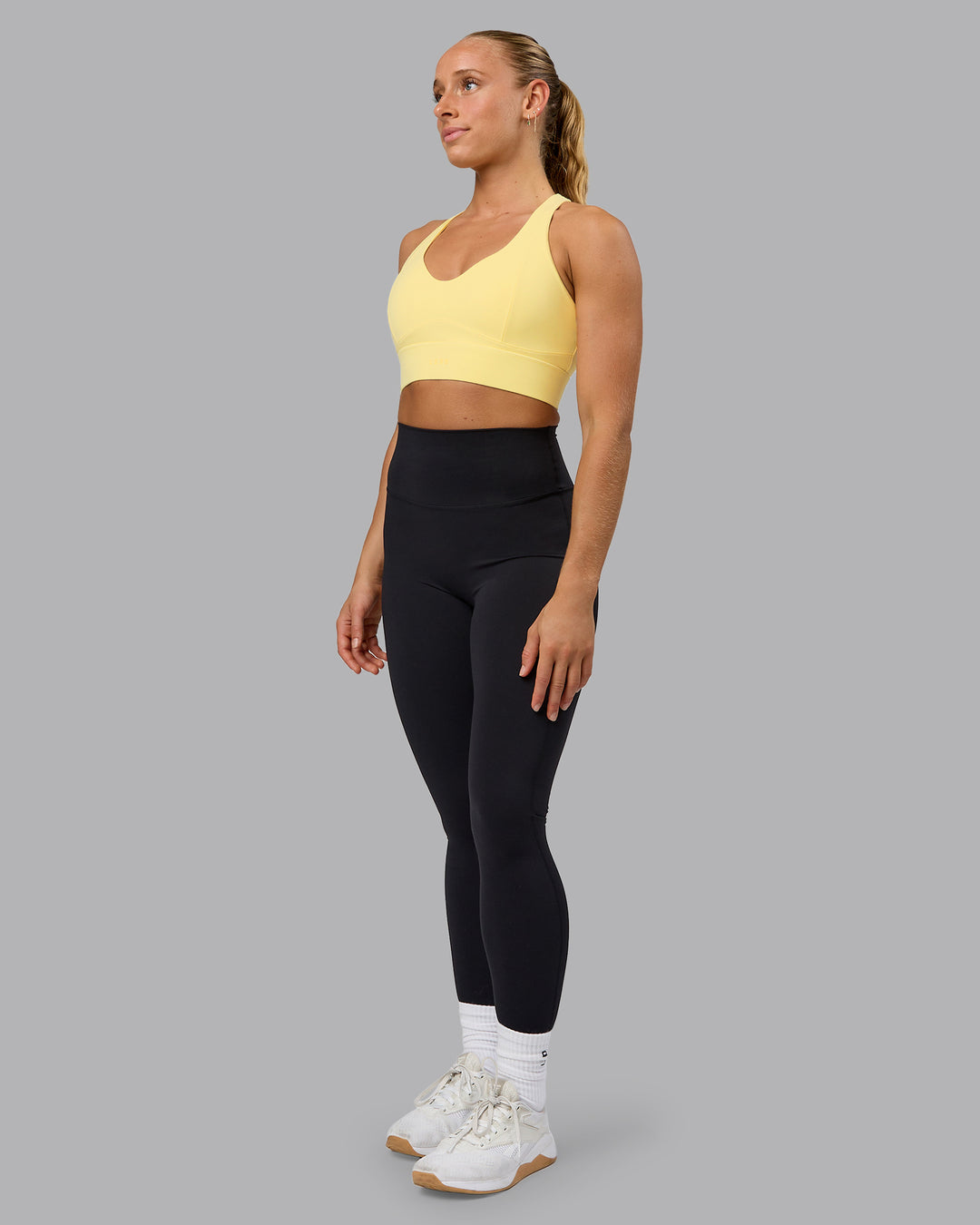 Woman wearing Sculpt Sports Bra - Lemon - view 6