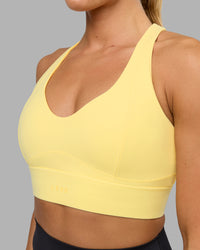Woman wearing Sculpt Sports Bra - Lemon | Thumbnail Index: 3