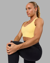 Woman wearing Sculpt Sports Bra - Lemon | Thumbnail Index: 4