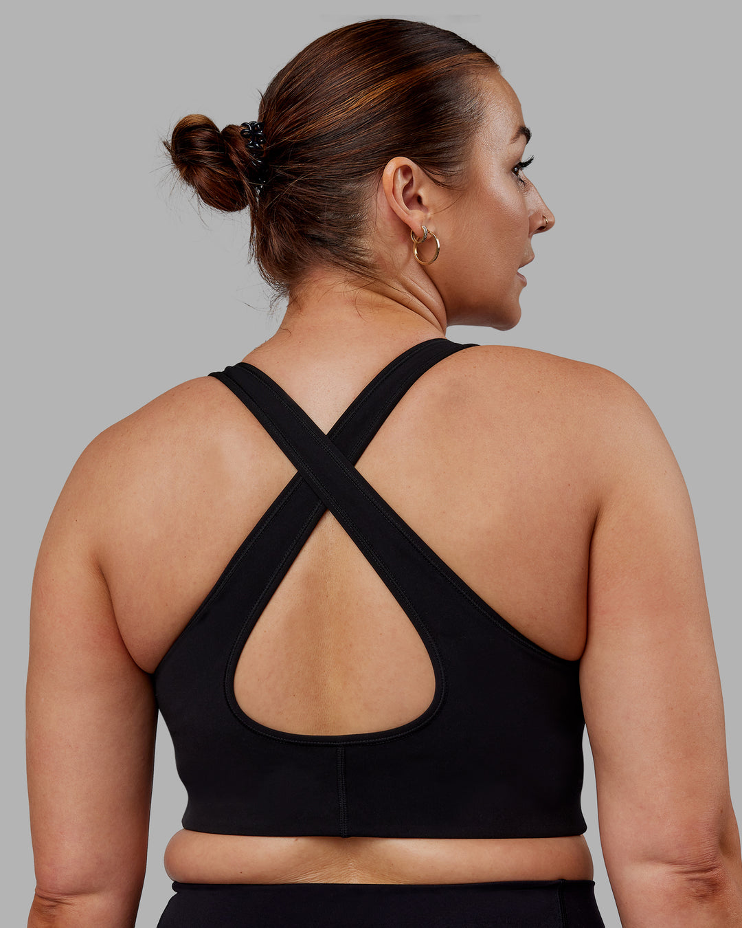 Woman wearing Stamina Sports Bra (D/DD/E) - Black | Model:Tegan | Size:M - view 2