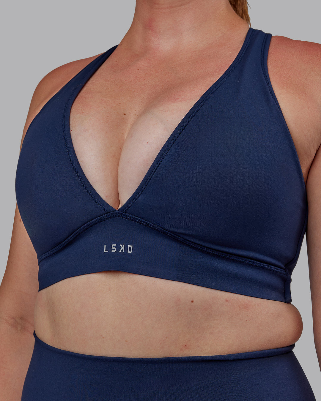 Woman wearing Stamina Sports Bra -(D/DD/E) - Future Navy | Model:Tegan | Size:M - view 4