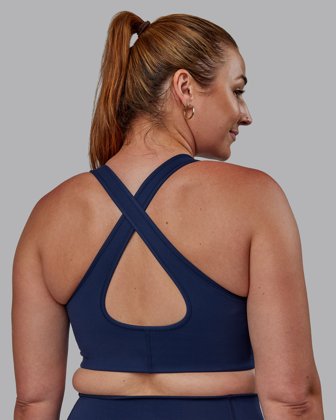 Woman wearing Stamina Sports Bra -(D/DD/E) - Future Navy | Model:Tegan | Size:M - view 2