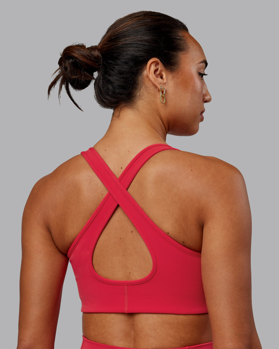 Woman wearing Stamina Sports Bra in Scarlet | Size:S - view 2