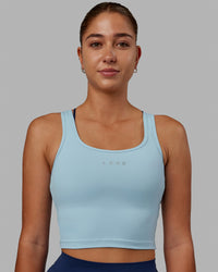 Woman wearing Staple Active Cropped Tank - Glacial Blue | Thumbnail Index: 2