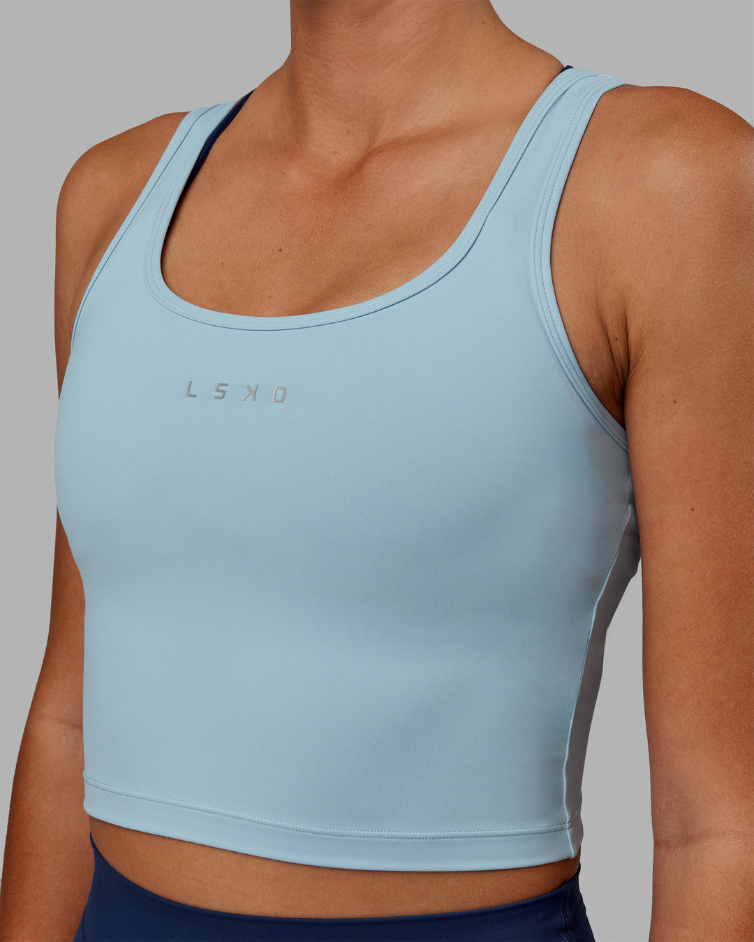 Woman wearing Staple Active Cropped Tank - Glacial Blue - view 7