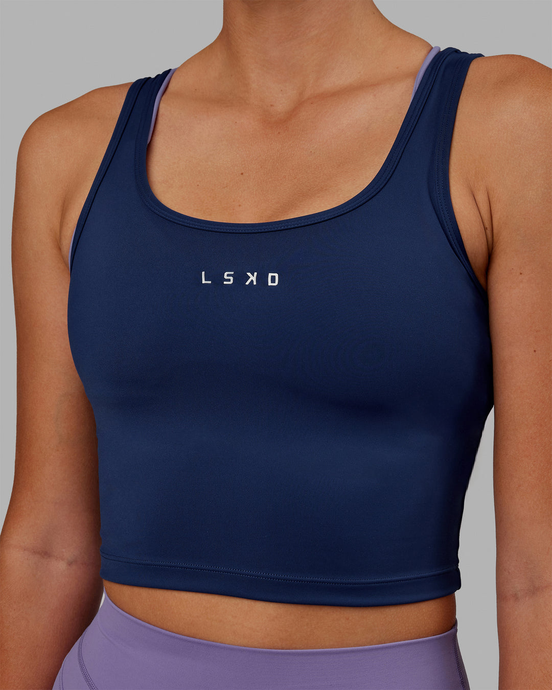 Woman wearing Staple Active Cropped Tank - Midnight Blue - view 7