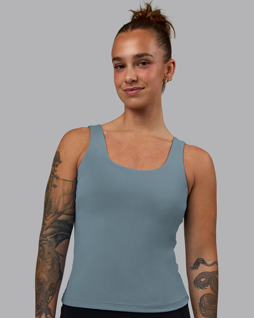 Woman wearing Staple Active Shelf Bra Tank - Elemental Blue - view 1