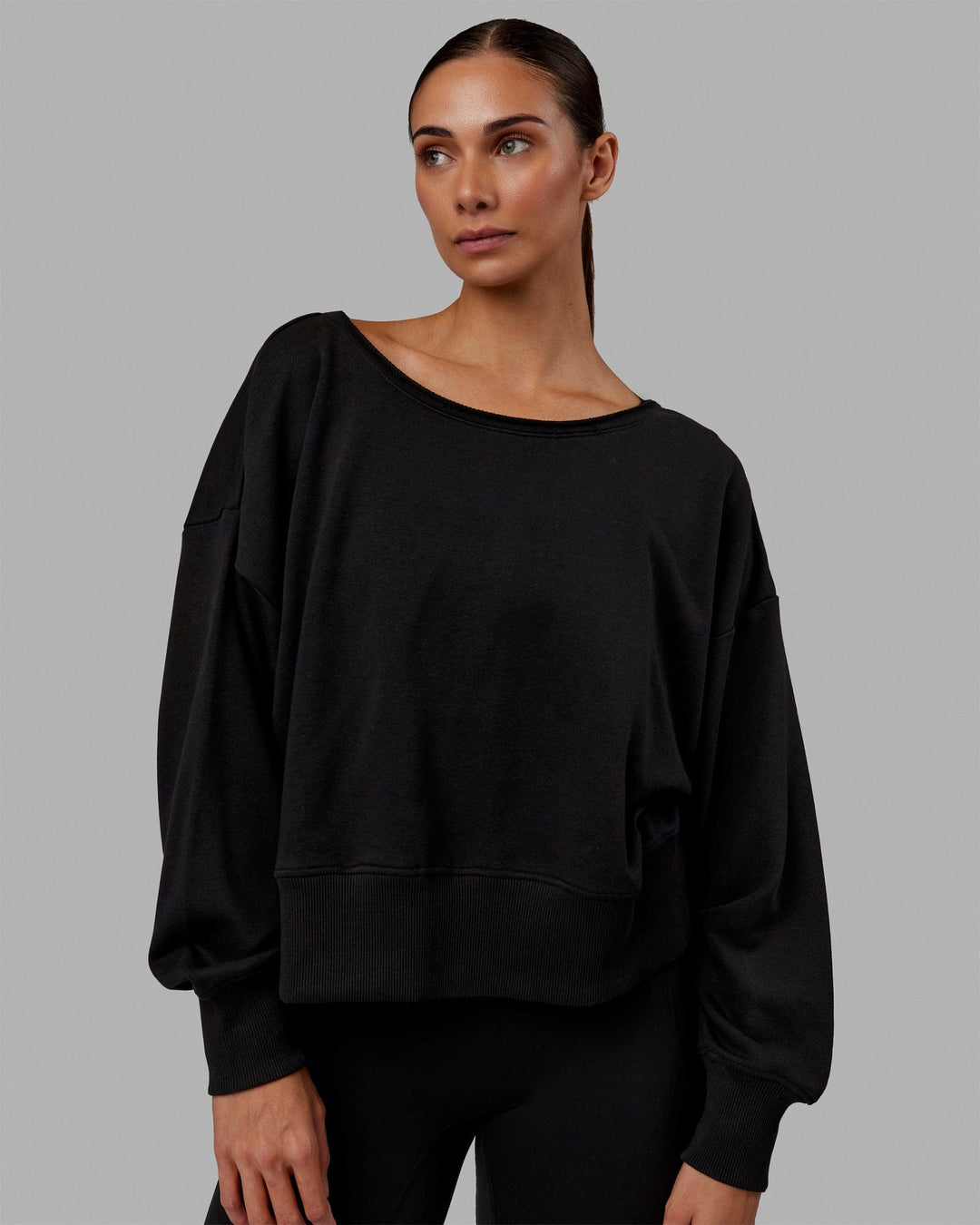 Woman wearing Tempo Sweater - Black - view 1