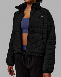 Woman wearing Thrive Packable Jacket - Black | Thumbnail Index: 11