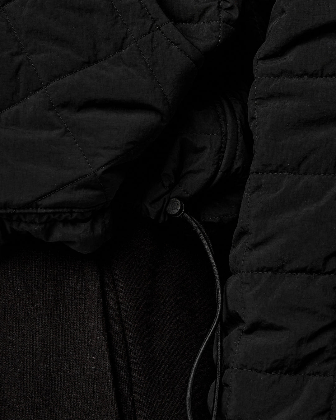 Woman wearing Thrive Packable Jacket - Black - view 9