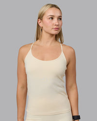 Woman wearing Transition CloudFLX Shelf Bra Tank - Ivory | Thumbnail Index: 0