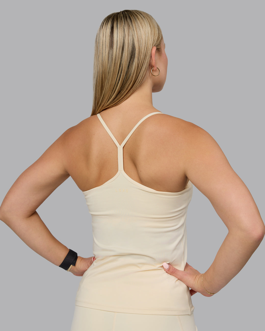 Woman wearing Transition CloudFLX Shelf Bra Tank - Ivory - view 3
