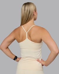 Woman wearing Transition CloudFLX Shelf Bra Tank - Ivory | Thumbnail Index: 2
