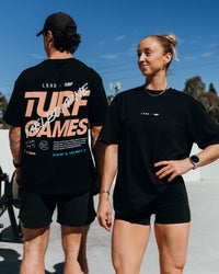 Duo wearing Turf Games Melbourne FLXCotton Oversize Tee - Black | Model:Both | Size:Duo | Thumbnail Index: 0