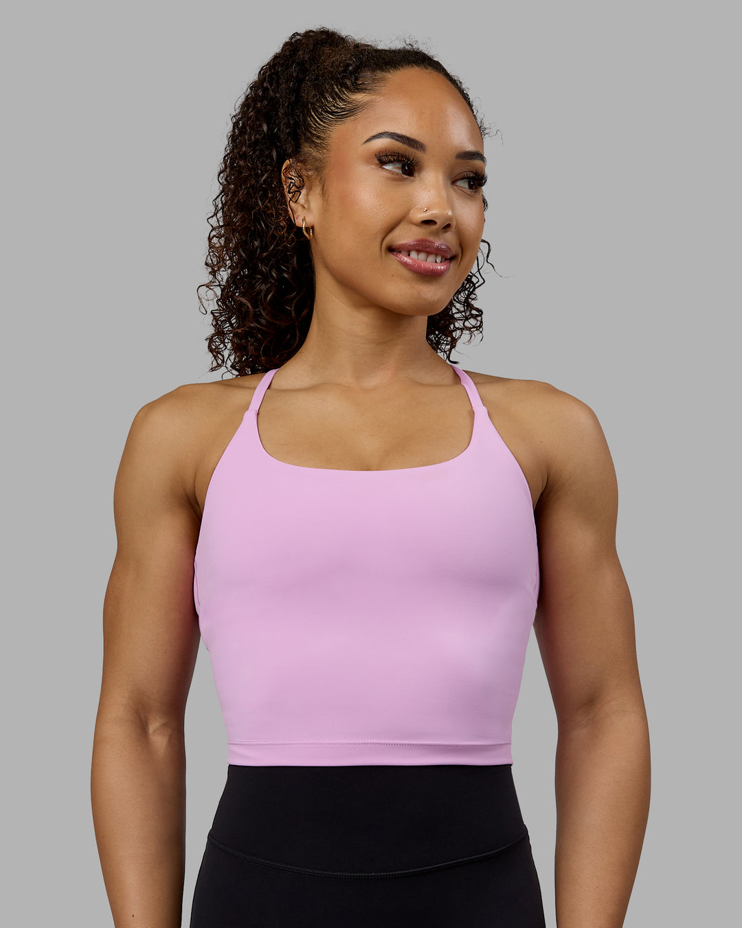 Woman wearing Twist Shelf Bra Tank - Pastel Orchid - view 1