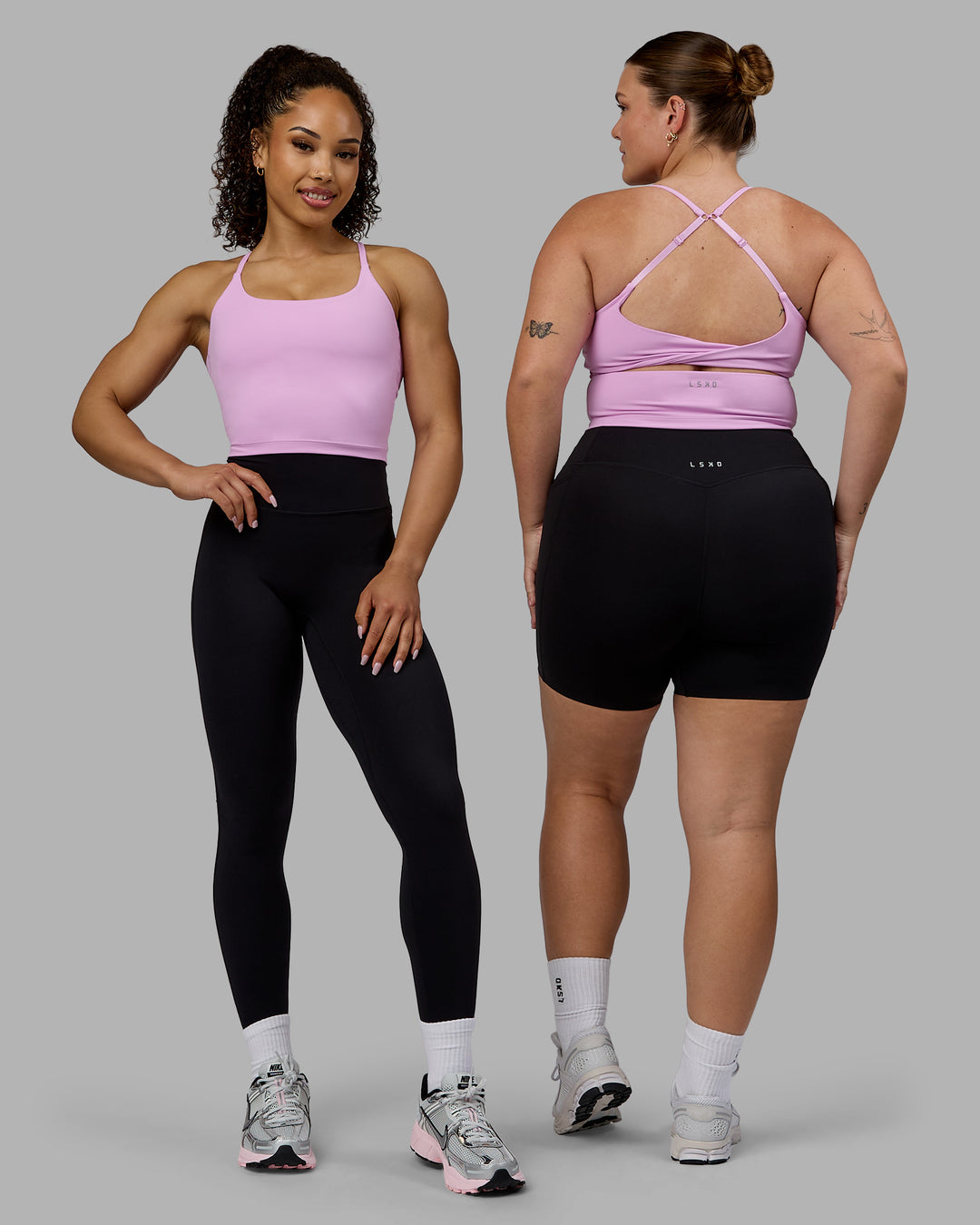 Woman wearing Twist Shelf Bra Tank - Pastel Orchid - view 3