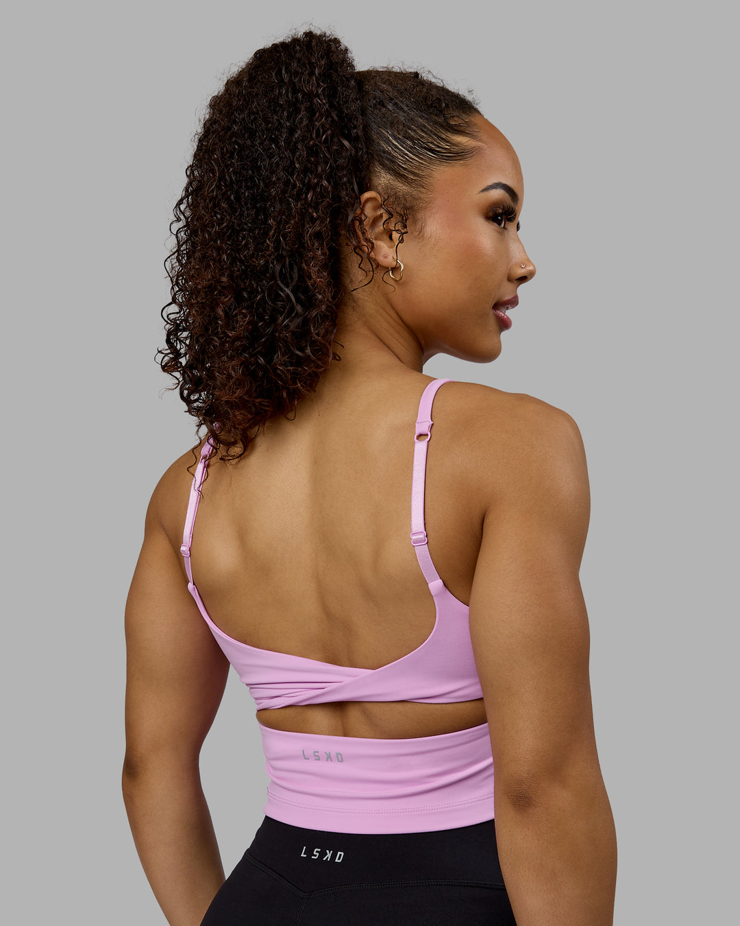 Woman wearing Twist Shelf Bra Tank - Pastel Orchid - view 6