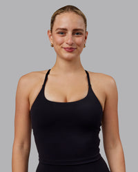 Woman wearing Twist Shelf Bra Tank - Black | Thumbnail Index: 0