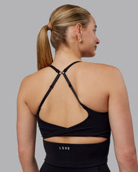 Woman wearing Twist Shelf Bra Tank - Black | Thumbnail Index: 4