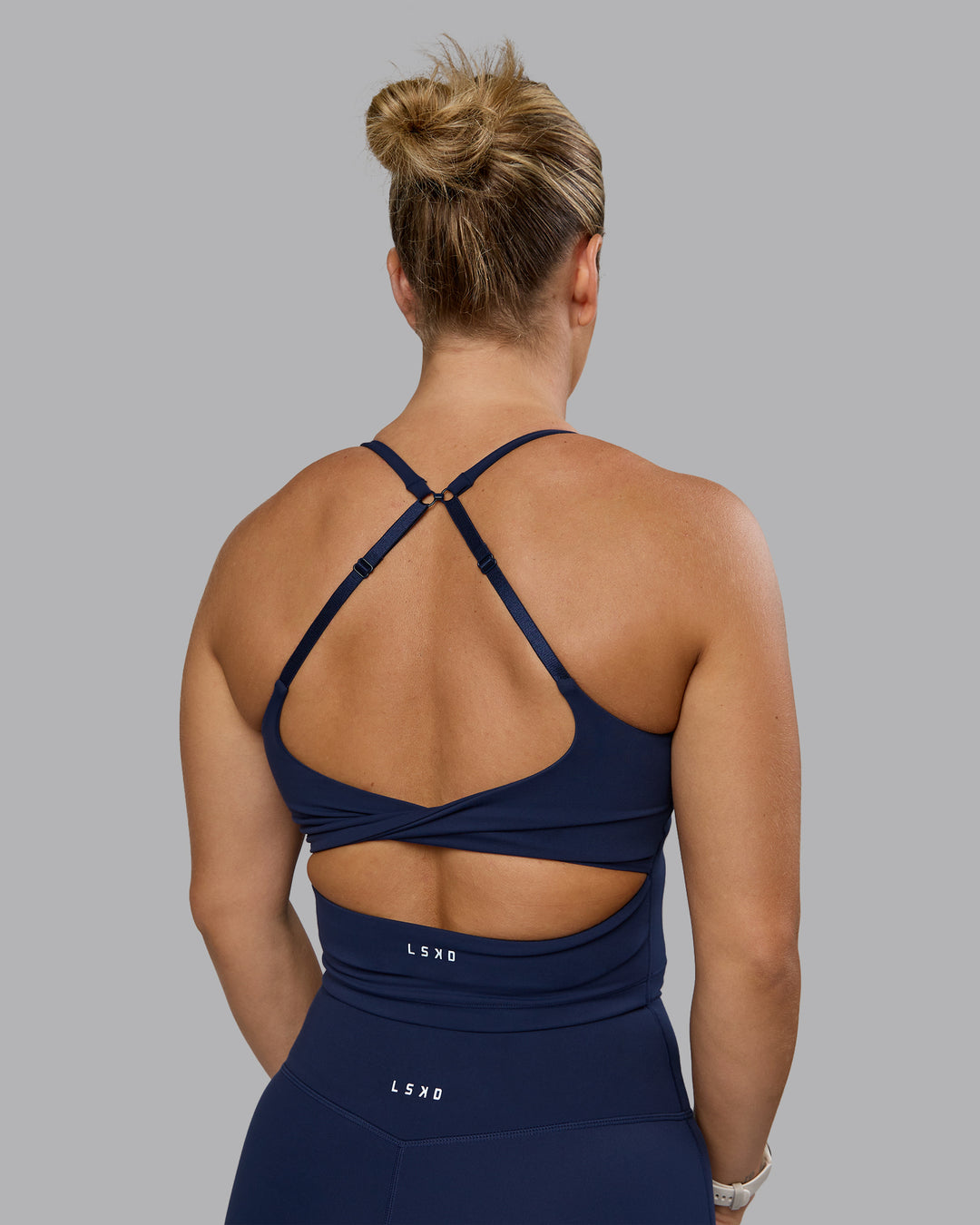 Woman wearing Twist Shelf Bra Tank - Future Navy - view 9