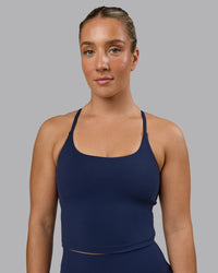 Woman wearing Twist Shelf Bra Tank - Future Navy | Thumbnail Index: 0