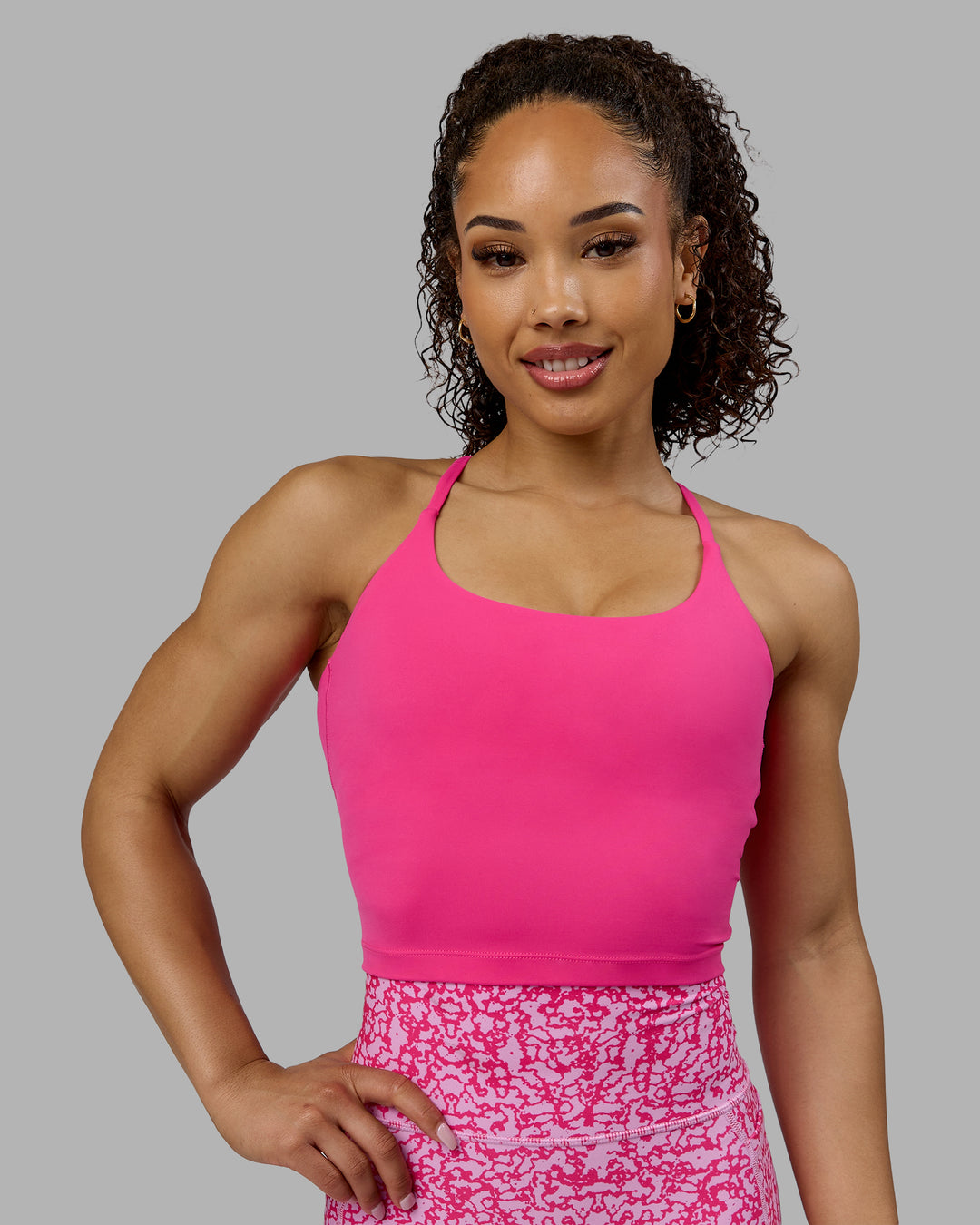 Woman wearing Twist Shelf Bra Tank - Ultra Pink - view 4