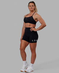 Woman wearing Lift Sports Bra - Black | Thumbnail Index: 4