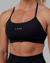 Woman wearing Lift Sports Bra - Black | Thumbnail Index: 7