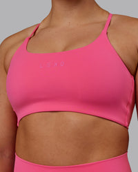 Woman wearing Twist Sports Bra - Carmine Rose | Thumbnail Index: 7