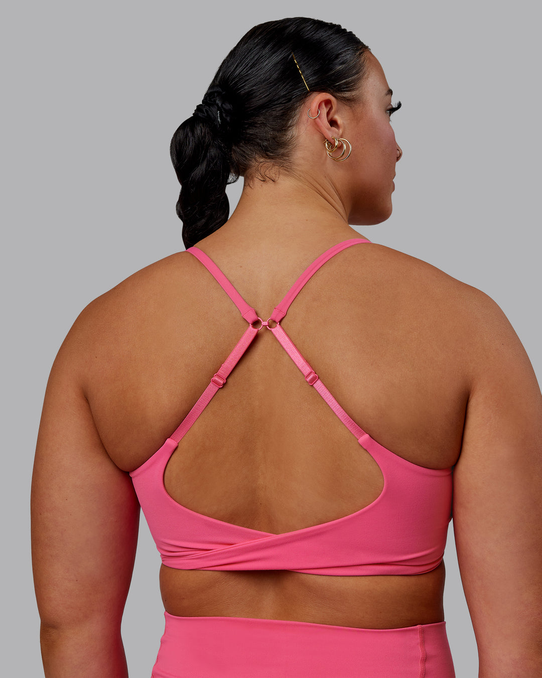 Woman wearing Twist Sports Bra - Carmine Rose - view 7