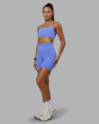 Woman wearing Twist Sports Bra - Indulgent Blue | Thumbnail Index: 5