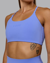 Woman wearing Twist Sports Bra - Indulgent Blue | Thumbnail Index: 7