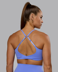Woman wearing Twist Sports Bra - Indulgent Blue | Thumbnail Index: 2