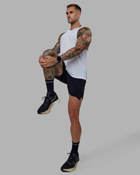 Man wearing UltraAir 5" Lined Performance Short - Black-Reflective | Thumbnail Index: 7