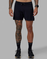 Man wearing UltraAir 5" Lined Performance Short - Black-Reflective | Thumbnail Index: 0