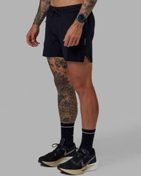 Man wearing UltraAir 5" Lined Performance Short - Black-Reflective | Thumbnail Index: 3