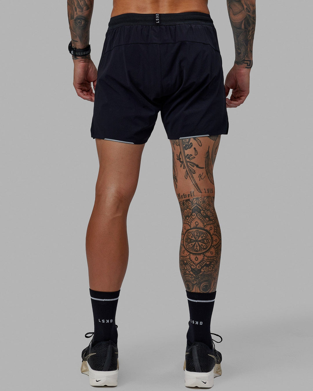 Man wearing UltraAir 5" Lined Performance Short - Black-Reflective - view 5