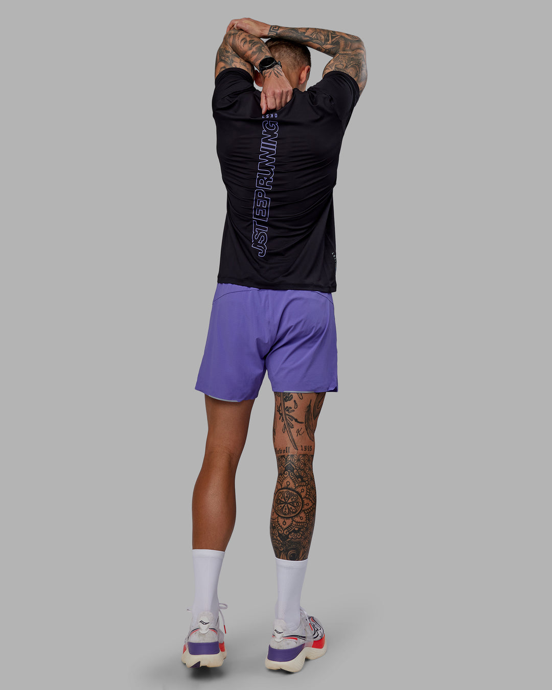 Man wearing UltraAir 5" Lined Performance Shorts - Dahlia Purple - view 3