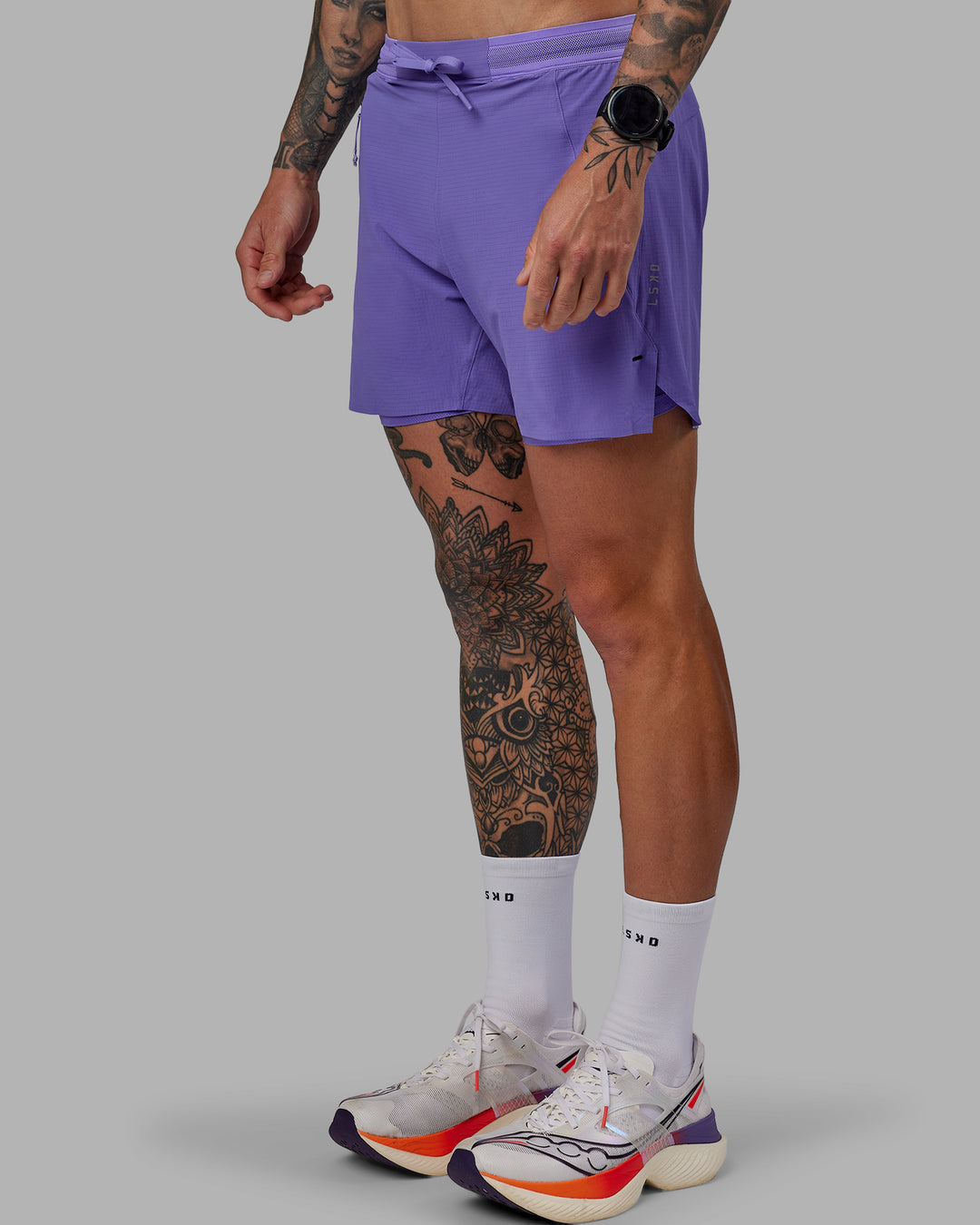 Man wearing UltraAir 5" Lined Performance Shorts - Dahlia Purple - view 6