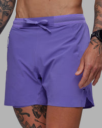Man wearing UltraAir 5" Lined Performance Shorts - Dahlia Purple | Thumbnail Index: 0