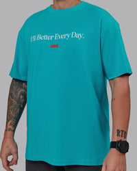 Man wearing Unisex 1% Better FLXCotton Tee Oversize - Blue Bird-White | Thumbnail Index: 8