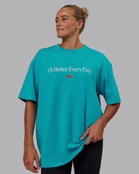 Woman wearing Unisex 1% Better FLXCotton Tee Oversize - Blue Bird-White | Thumbnail Index: 4