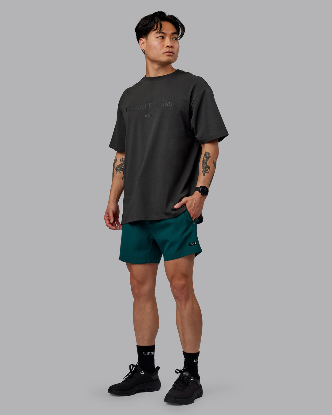 Man wearing Unisex 1% Better FLXCotton Tee Oversize - Pirate Black-Black - view 6