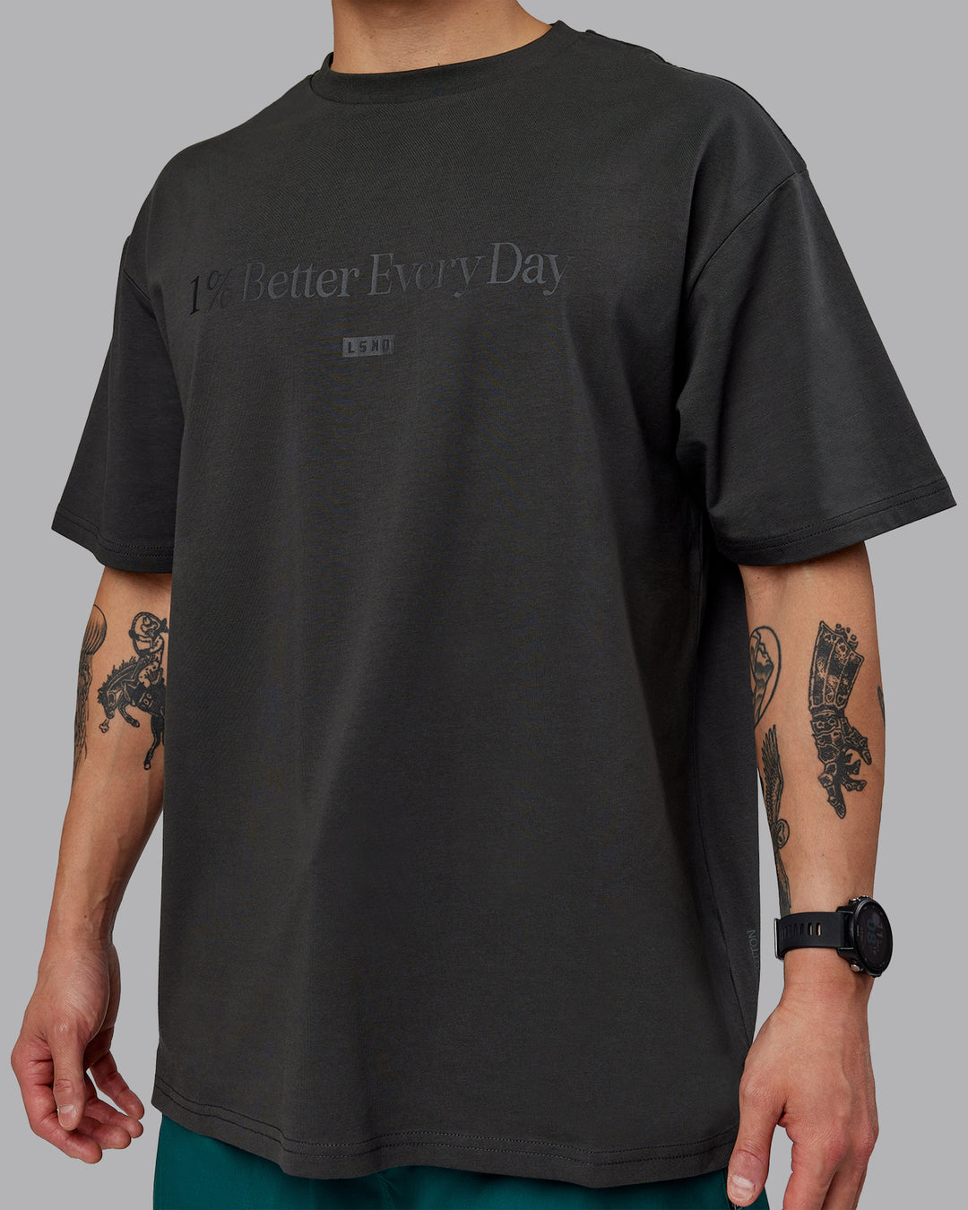 Man wearing Unisex 1% Better FLXCotton Tee Oversize - Pirate Black-Black - view 8