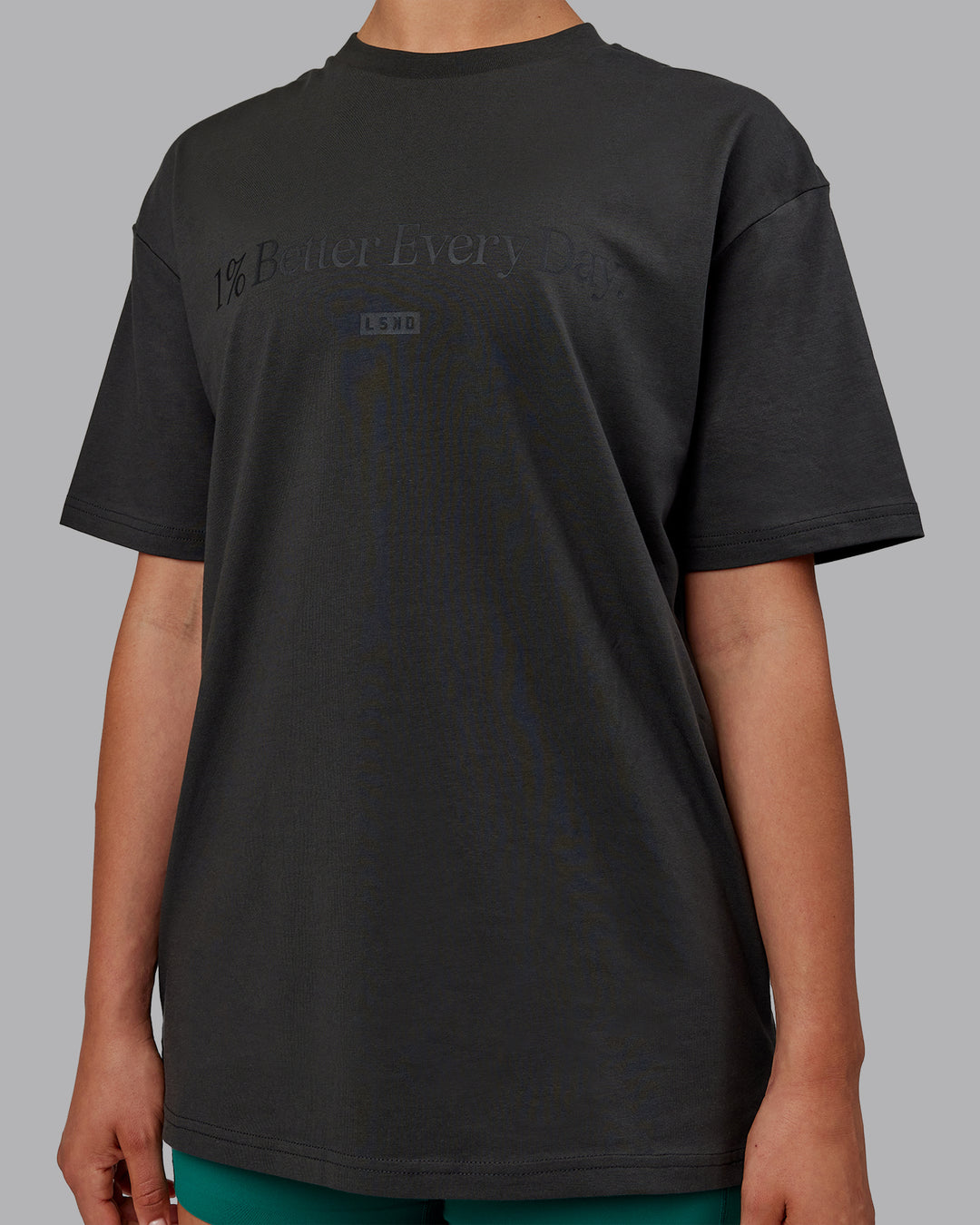Woman wearing Unisex 1% Better FLXCotton Tee Oversize - Pirate Black-Black - view 9