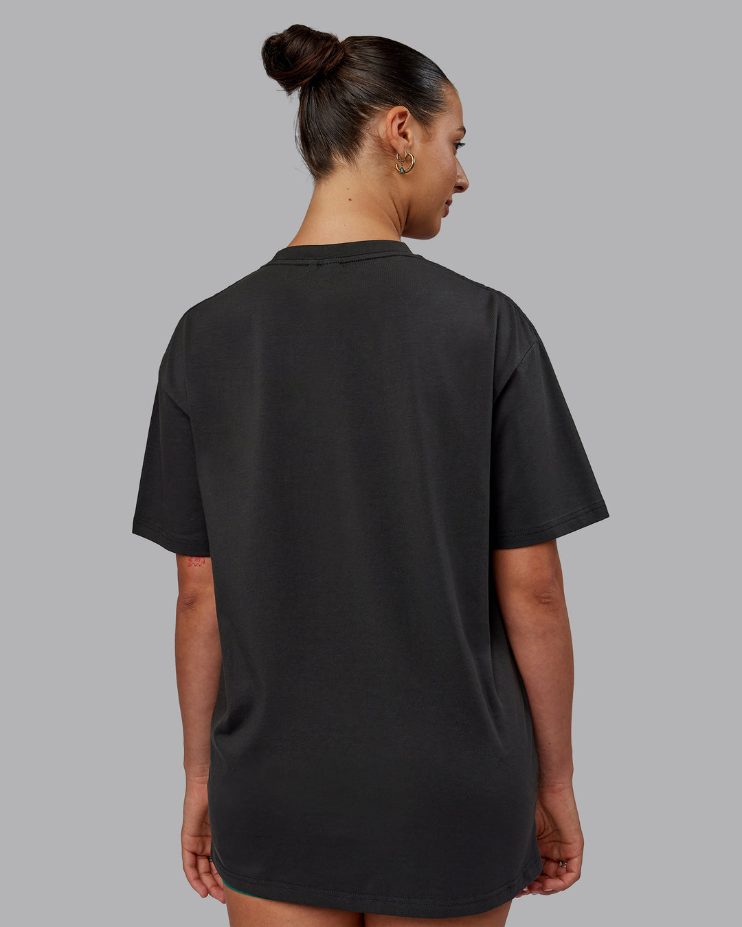 Man wearing Unisex 1% Better FLXCotton Tee Oversize - Pirate Black-Black - view 12