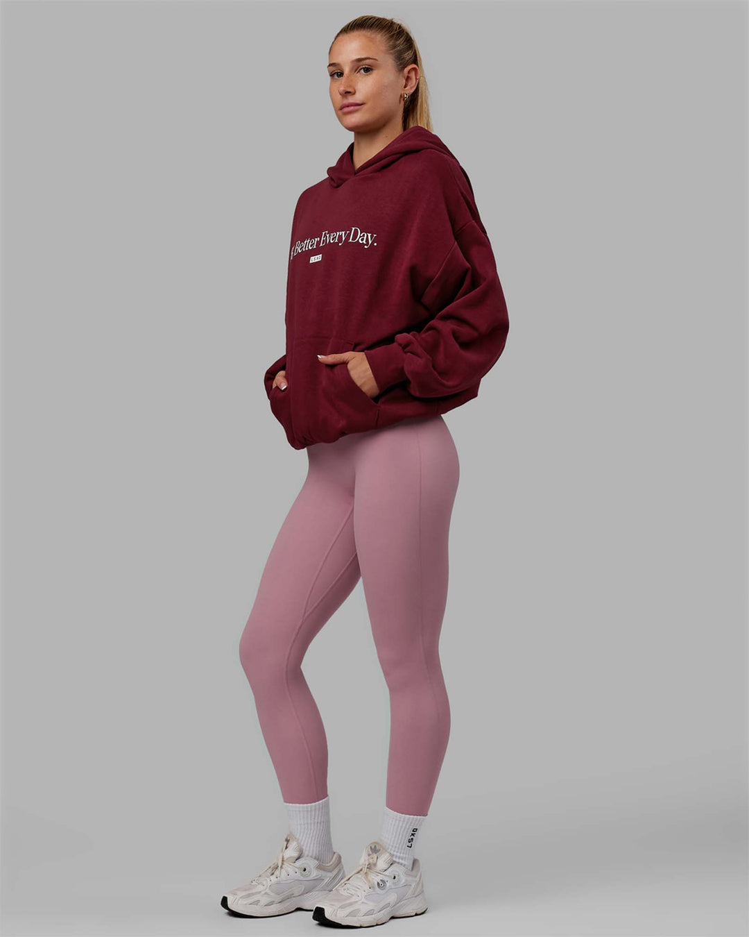 Woman wearing Unisex 1% Better Hoodie Oversize - Cranberry-White - view 5