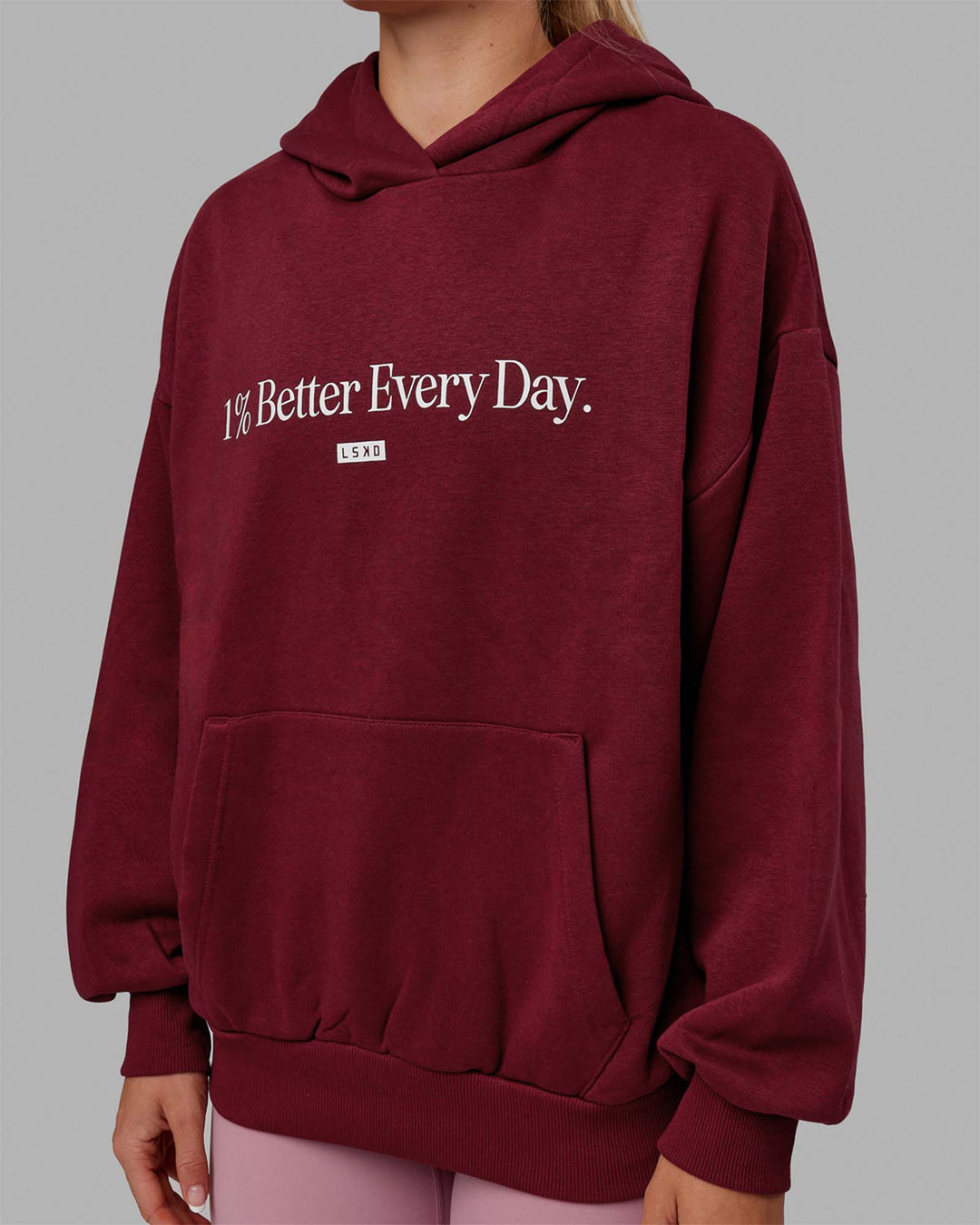 Woman wearing Unisex 1% Better Hoodie Oversize - Cranberry-White - view 7