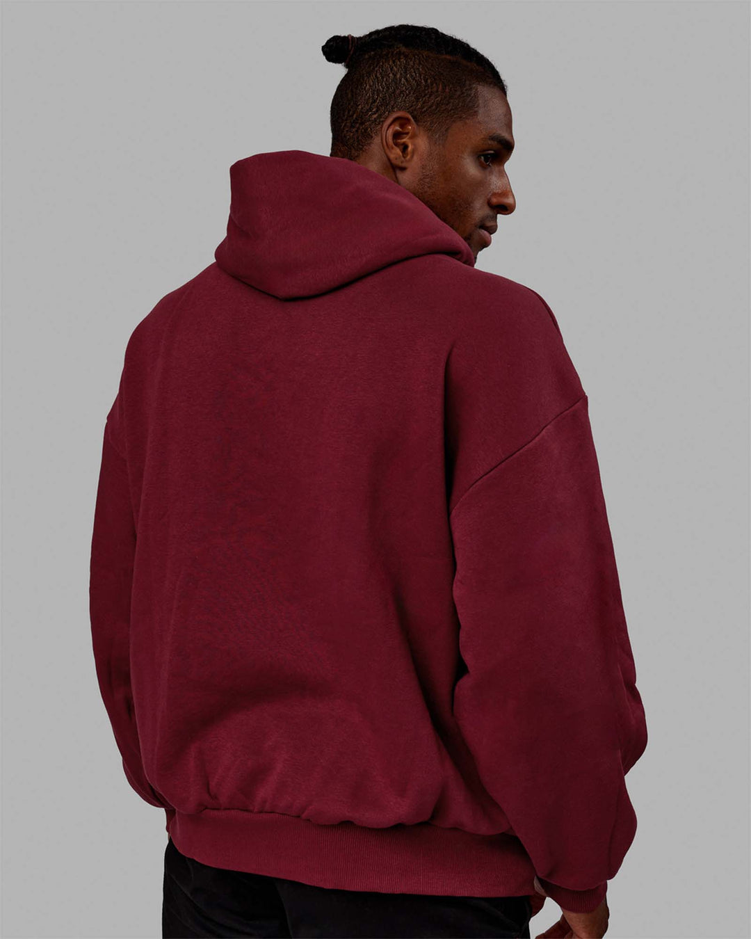 Man wearing Unisex 1% Better Hoodie Oversize - Cranberry-White - view 4